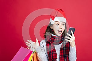 Surprised Woman shopping for christmas gifts