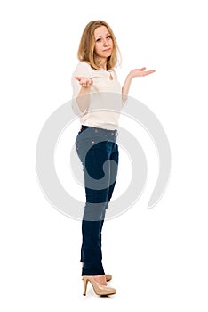 Surprised woman showing open hand palm with copy space for product or tex