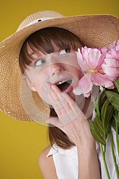 Surprised woman in summer hat