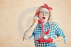 Surprised woman talking by phone