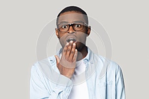 Surprised young african american man looking at camera.