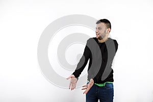 Surprised nice and modern young with beard looking sideway isolated on white background