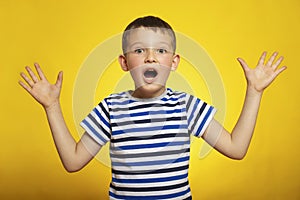 Surprised Young Boy in Striped Shirt