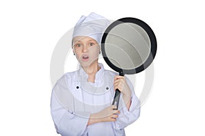 Surprised young chef with a pan
