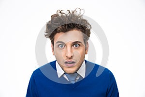 Surprised young man looking at the camera