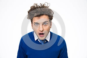 Surprised young man looking at the camera