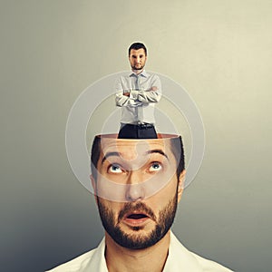 Surprised young man looking up