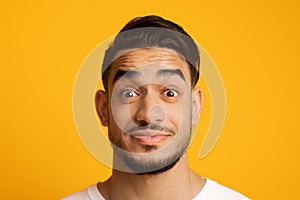 Surprised Young Middle Eastern Man Looking At Camera With Wide Open Eyes