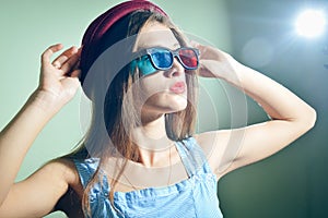 Surprised young pretty woman in 3d glasses looking amazed.