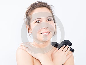 a Surprised young woman expressing positively excited hands on shoulders