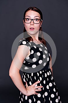 Surprised young woman in glasses