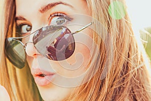 Surprised Young Woman in Sunglasses