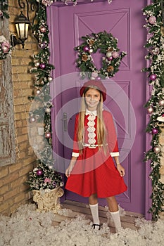 Surprisingly chic party ensemble. Fashionable small child. Small model with fashion look. Little fashionista on xmas