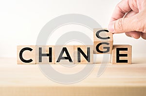 Surreal abstract geometric floating wooden cube with word CHANGE and CHANCE concept on wood floor and white background