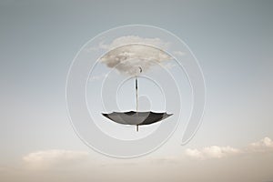 surreal cloud carrying an umbrella in the sky, abstract concept