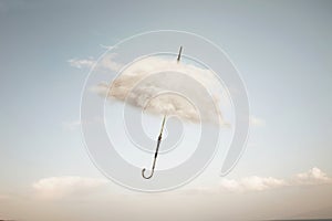 surreal cloud cover of an umbrella flying in the sky, abstract concept