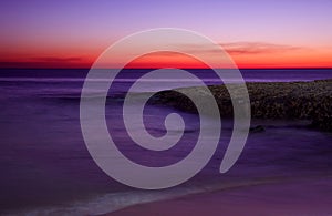 Surreal deserted sandy beach after dusk