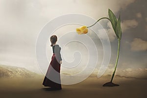 Surreal encounter between a woman and a giant tulip photo