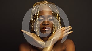 Surreal Fashion Portrait of African American Female Model with Golden Glossy Headwear. Creative Vogue Concept, Black