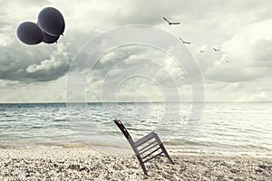 Surreal image of a chair held in balance by flying balloons