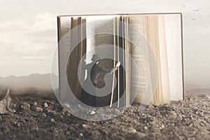 Surreal image of a curious woman leafing through a giant book