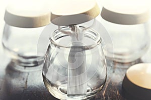 Surreal image of victorious woman who frees herself from a glass vase