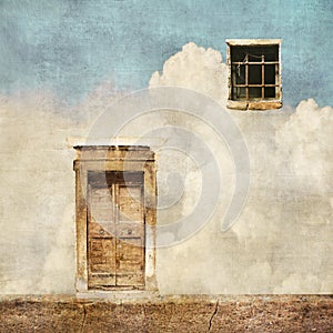 Surreal landscape with old door and window on cloudy sky