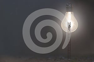 surreal man climbs a ladder to reach an illuminated light bulb, new ideas symbol concept