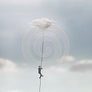 Surreal man reaches the sky hanging from a cloud