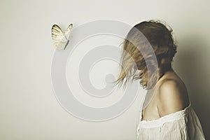 a surreal meeting of a butterfly with a woman, abstract concept photo
