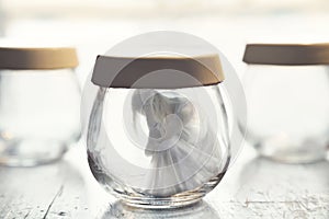 Surreal moment of a woman inside a glass jar