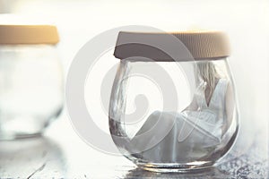 Surreal moment of a woman inside a glass jar photo