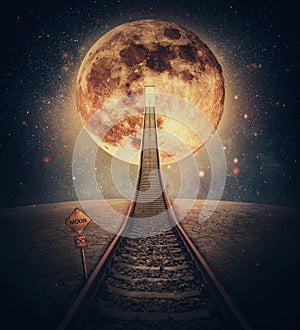 Surreal scene and a railway leading up to the moon. Imaginary night travel on a railroad transforming into a stairway going