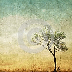 Surreal single tree on cloudy sky with copy space.