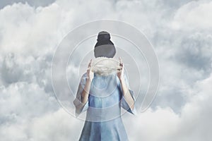 surreal small cloud hides a woman's face, concept of freedom