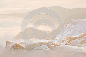 Surreal stone podium nature landscape outdoor on sky warm sun rise pastel soft cloud blurred background.Cosmetic product placement