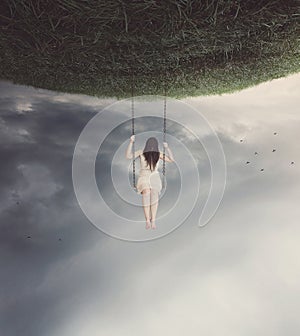 Surreal swing with woman