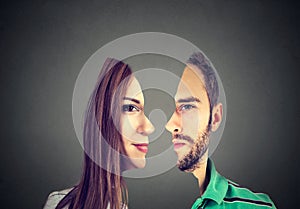 Surrealistic portrait front with cut out profile of a man and woman