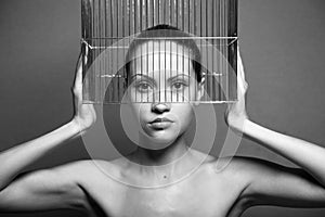 Surrealistic woman with cage