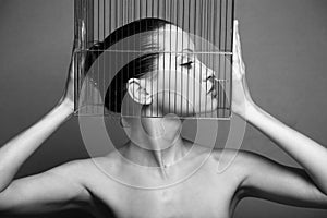 Surrealistic woman with cage