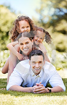 Surround yourself with the love and light of family. Portrait of a happy young family enjoying a fun day out at the park