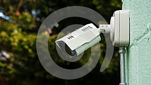 Surveillance camera on building with copy space