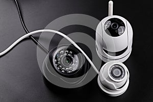 Surveillance camera, videcam, cctv camera isolated on black background close up. home security system