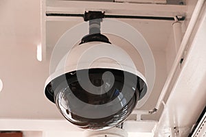 Surveillance cameras and a loudspeaker on the bulkhead of the ship's hull