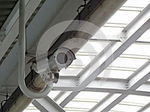 Surveillance security CCTV camera install under transparent roof for monitoring the movement from high angle view