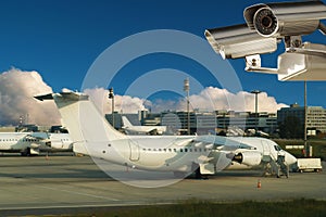 Surveillance video camera, airplanes, airport.