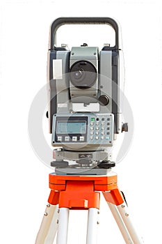 Survey equipment theodolite on a tripod. Isolated on white background