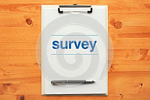 Survey questionnaire, overhead view of clipboard note pad