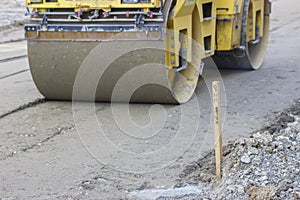 Survey stake marking the road