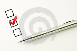 Survey template, questionnaire choice, marked check box with a pen on paper background photo